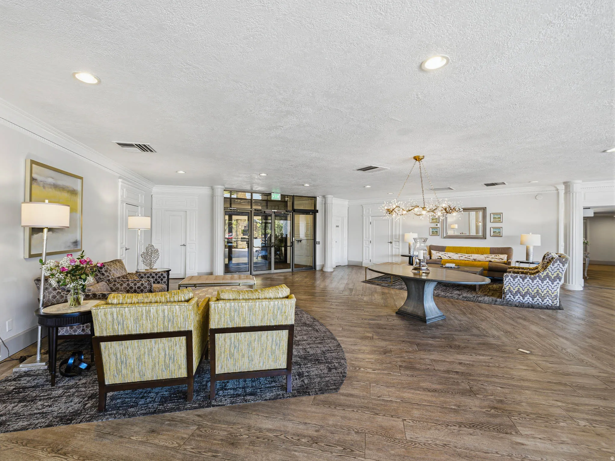 Spacious communal area featuring wood-finish flooring and recessed lighting