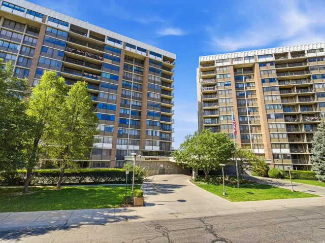 Twin high-rise buildings featuring extensive private balconies and numerous windows