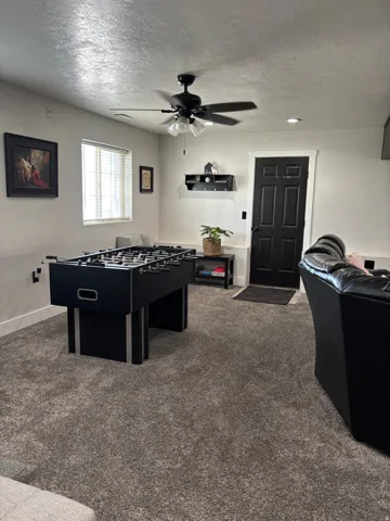 Spacious room featuring neutral carpeting and light-toned walls