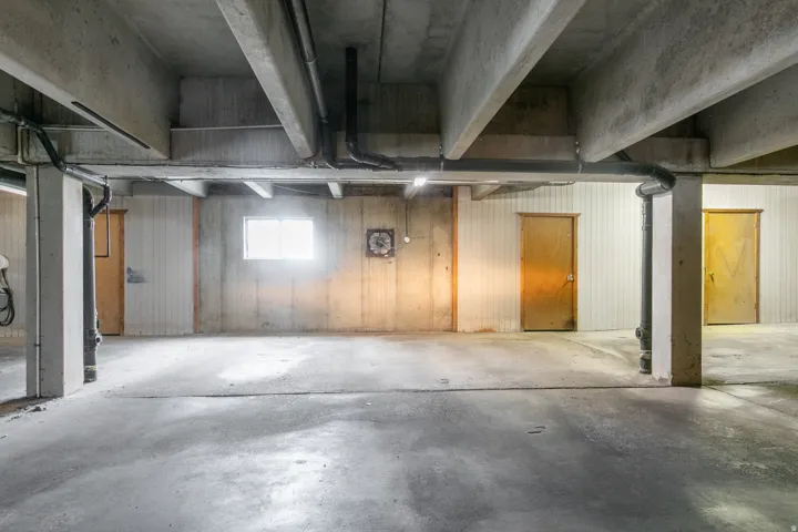 Concrete flooring with exposed ceiling beams and structural columns