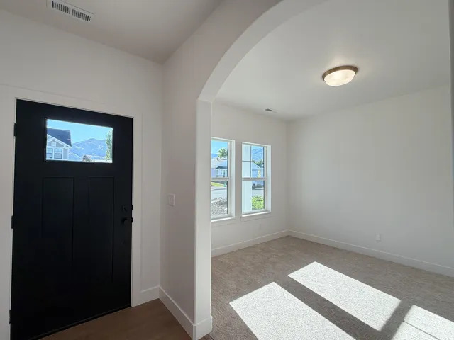 Black-paneled door with upper glass panel