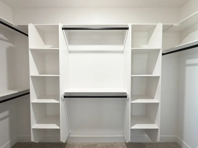 Built-in closet system with shelving and hanging rods
