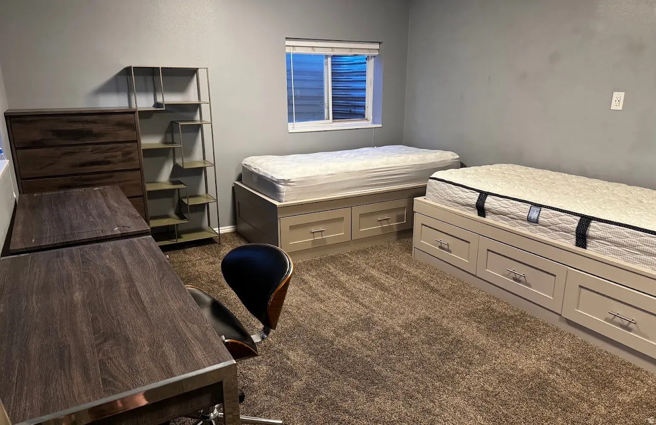 Carpeted room featuring a built-in window, neutral wall paint, and recessed lighting