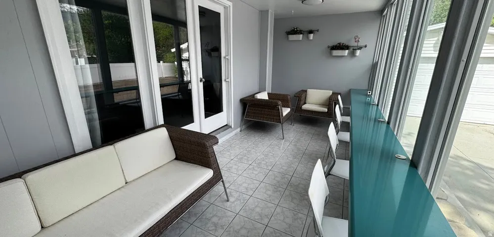 Sunroom connects to the first floor with double French by an exterior door