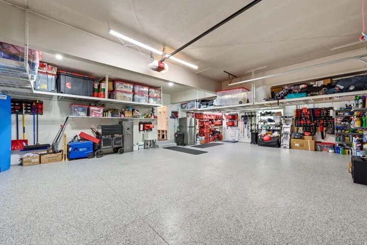 Spacious garage featuring a durable epoxy flooring finish