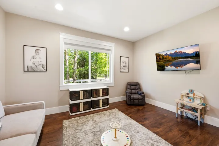 Spacious room with recessed lighting and warm beige wall tones