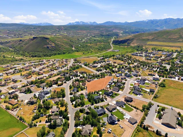 Expansive undeveloped lot with surrounding residential development