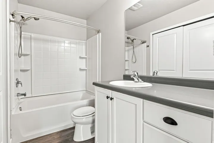 Master Bathroom featuring a white bathtub and shower combination with a curved shower rod