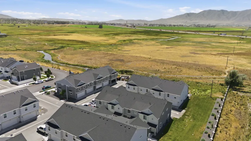 New construction townhomes featuring modern siding, asphalt shingle roofing, and integrated garages