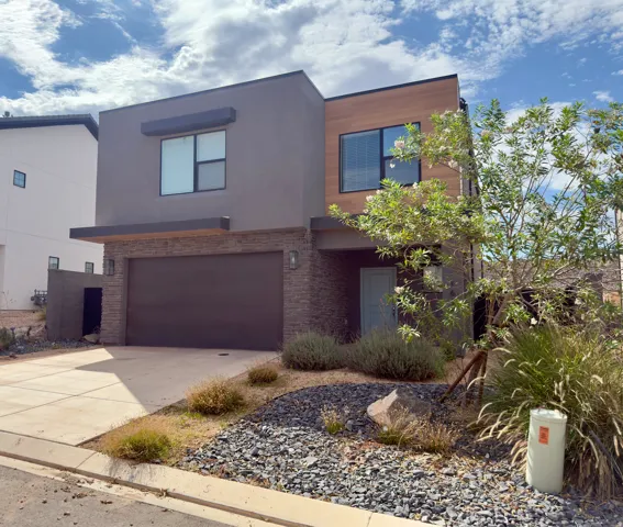 Contemporary facade featuring stucco and horizontal wood-finish siding