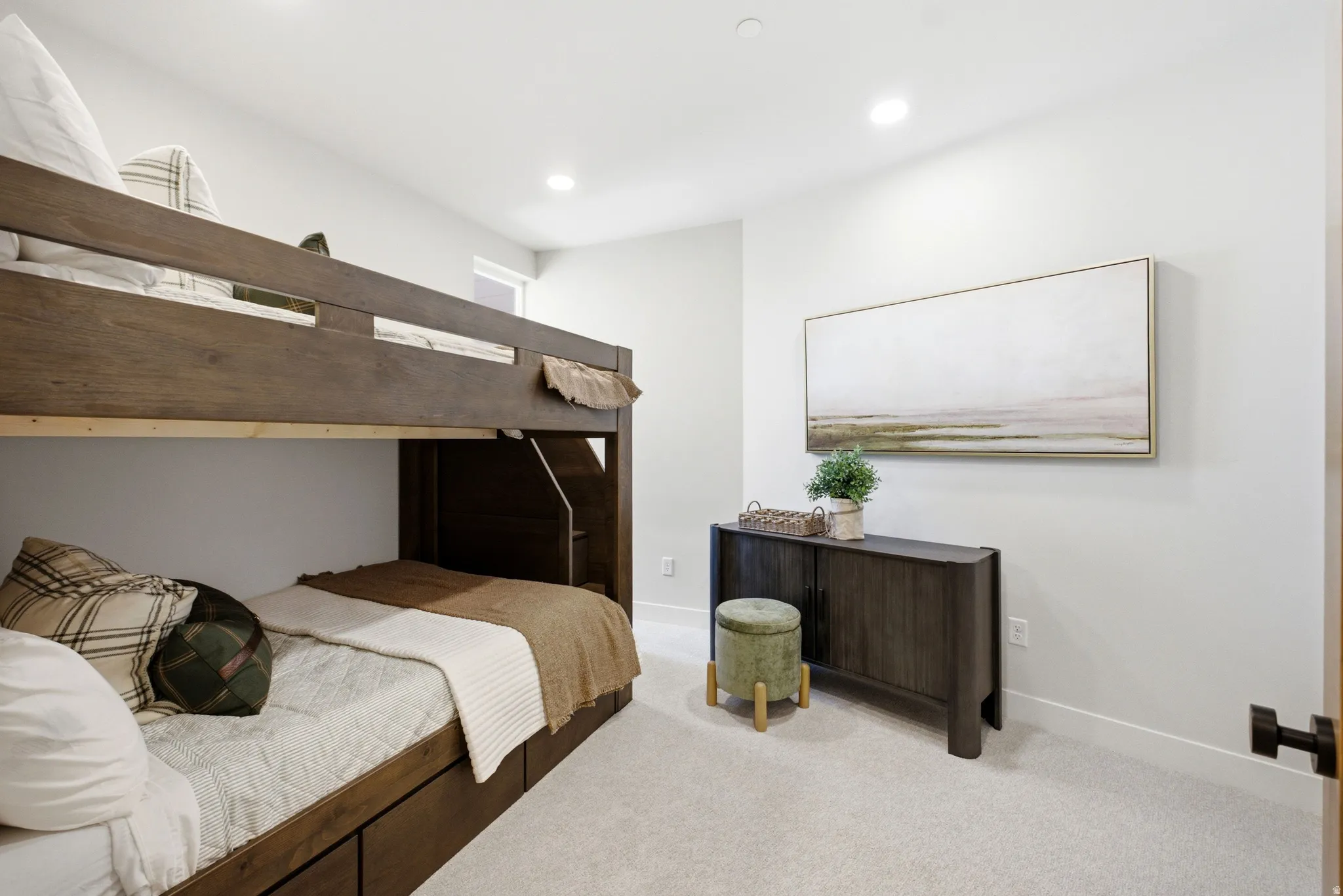 Room featuring a built-in bunk bed with integrated storage drawers