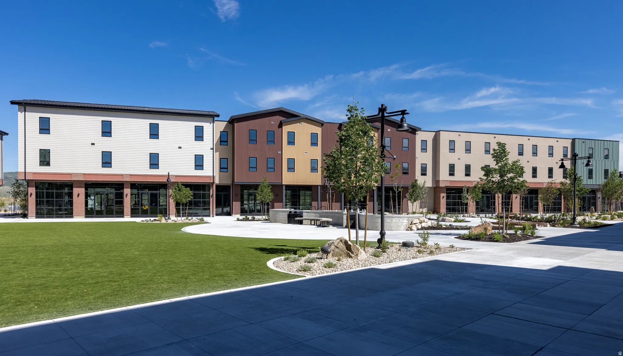 Modern multi-story buildings featuring varied facade colors and textures