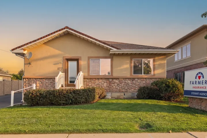 Stucco exterior with stone veneer accents