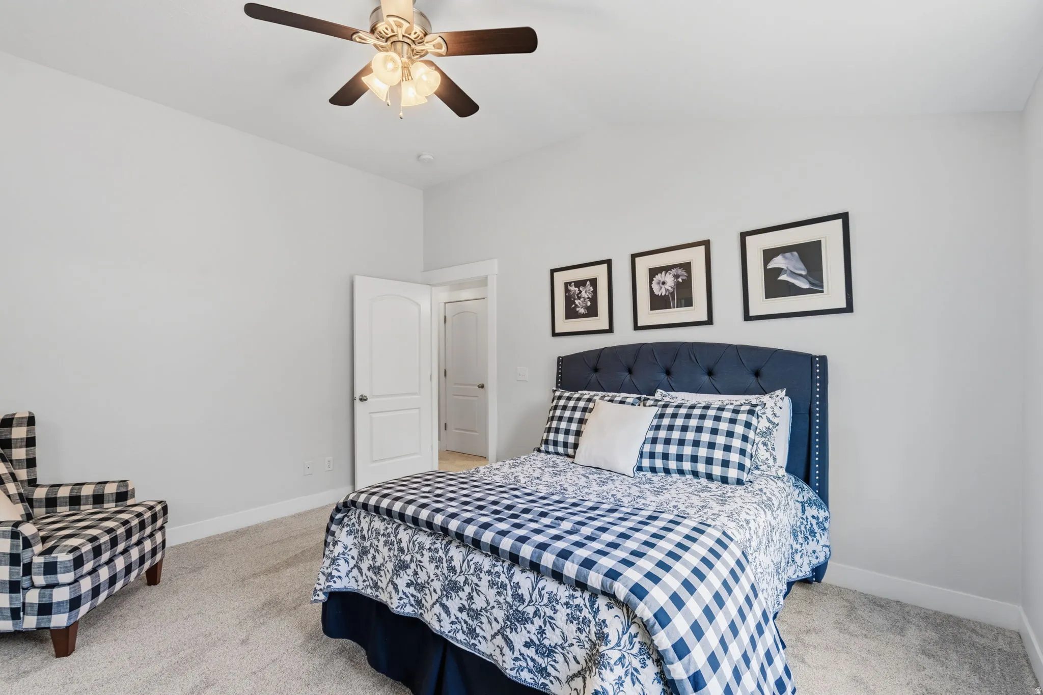 Bedroom featuring light-toned walls and plush carpet flooring