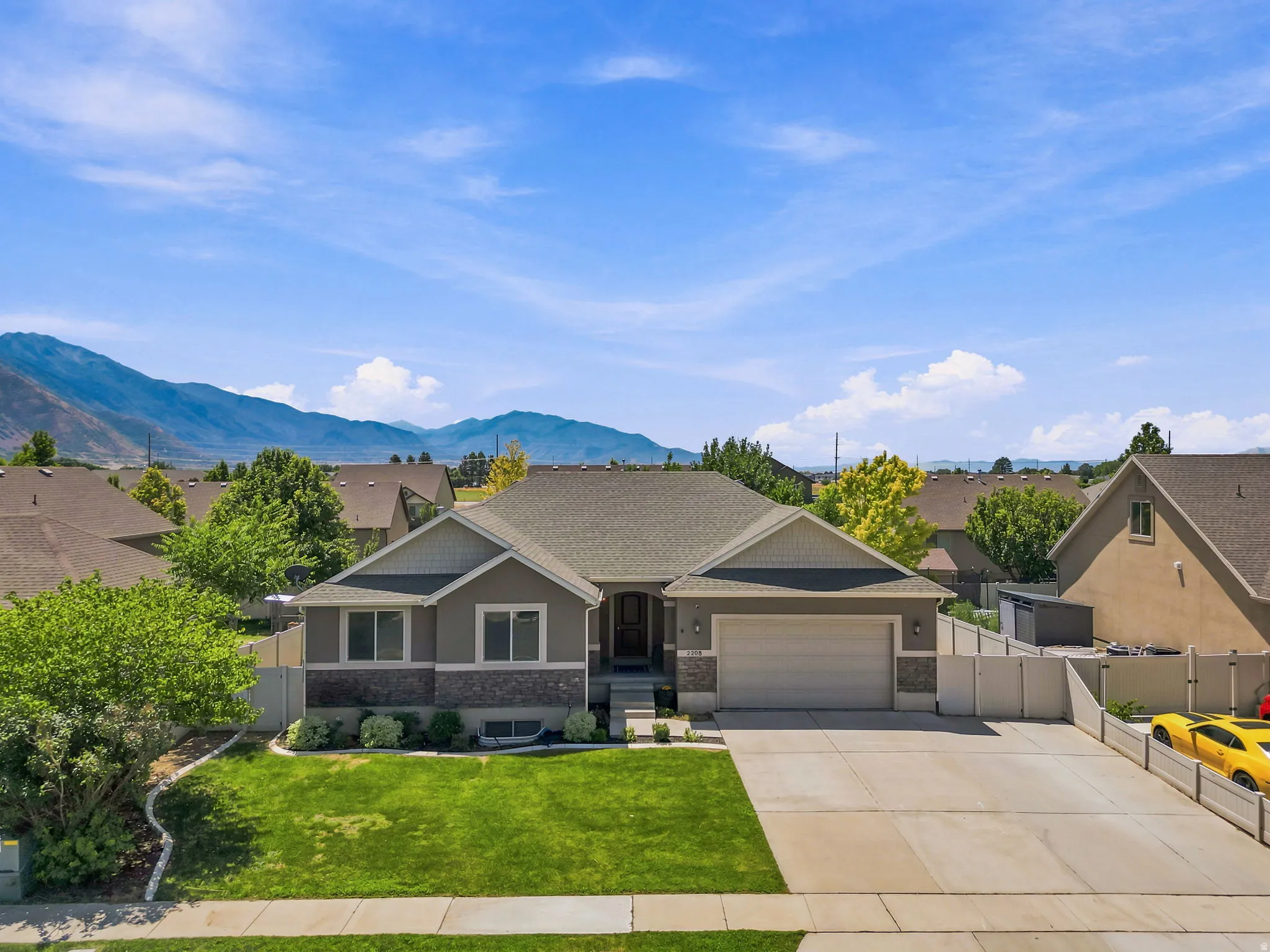 Ranch-style residence featuring a prominent two-car garage
