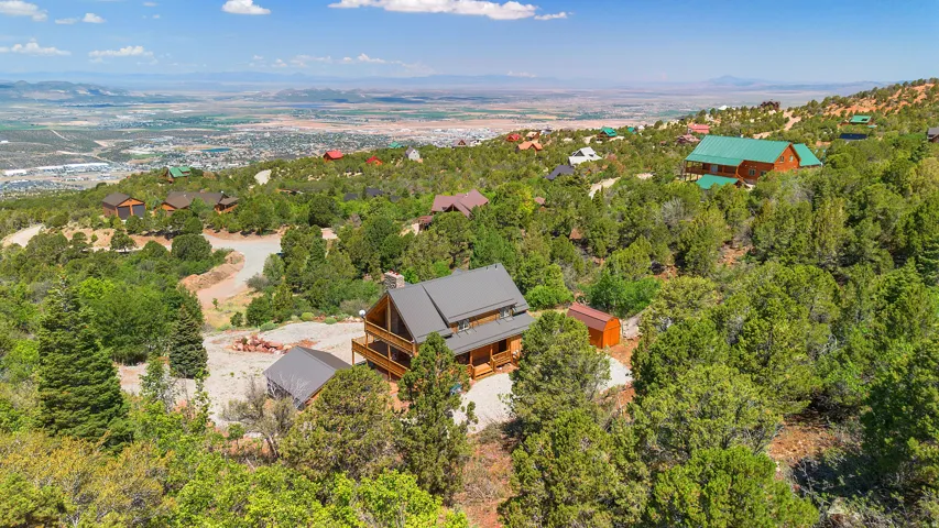 Log cabin style residence with an A-frame roofline and multi-level balconies