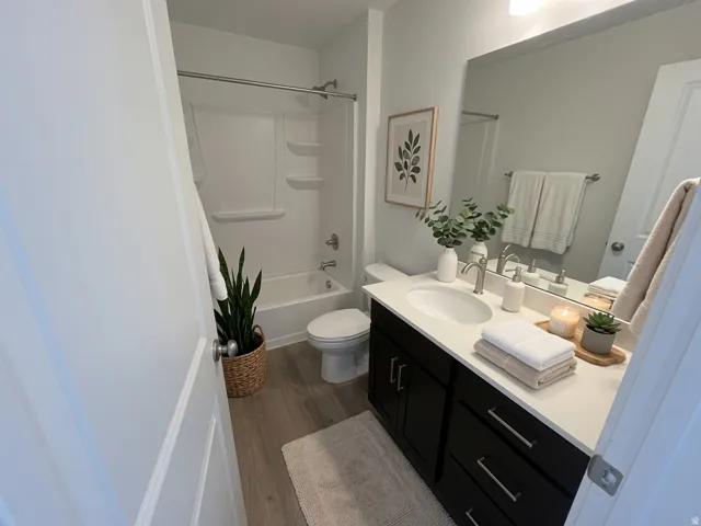 Full bathroom featuring a white tub and shower combination with a curved shower rod