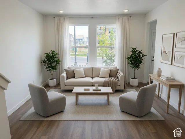 Bright living area featuring wood-finish flooring, recessed lighting, and a neutral color palette