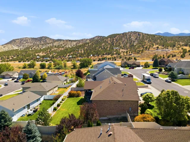 Expansive property featuring a large green lawn and mature landscaping