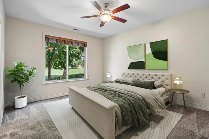 Bedroom featuring a large window, neutral wall paint, and textured carpeting