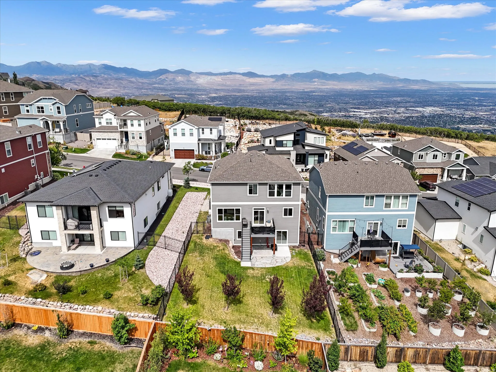 Expansive residential neighborhood featuring diverse architectural styles and a mountain backdrop