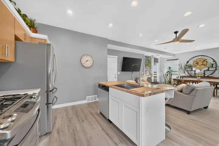 Open concept kitchen with wood-finish flooring