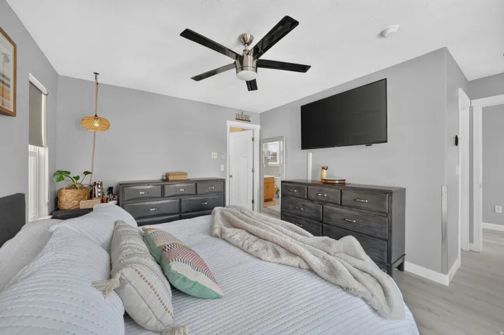 Room featuring light gray walls and wood-finish flooring