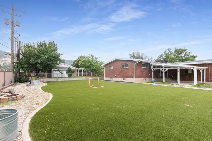 Expansive artificial turf lawn with a curved concrete border