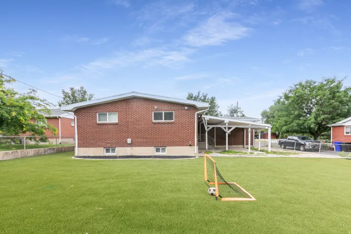Expansive artificial turf backyard