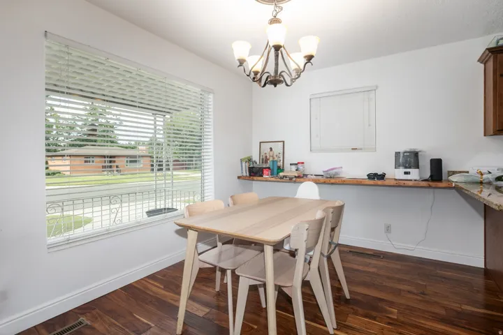 Dining area off kitchen with large window for natural light.