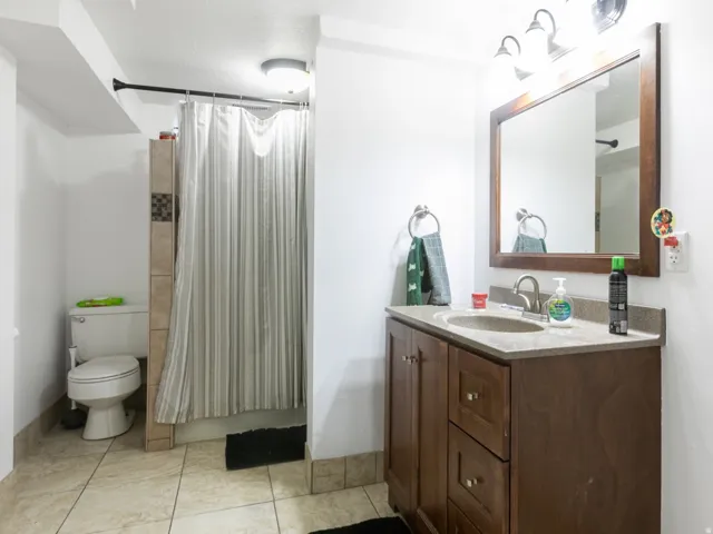 Full bath with tiled shower.