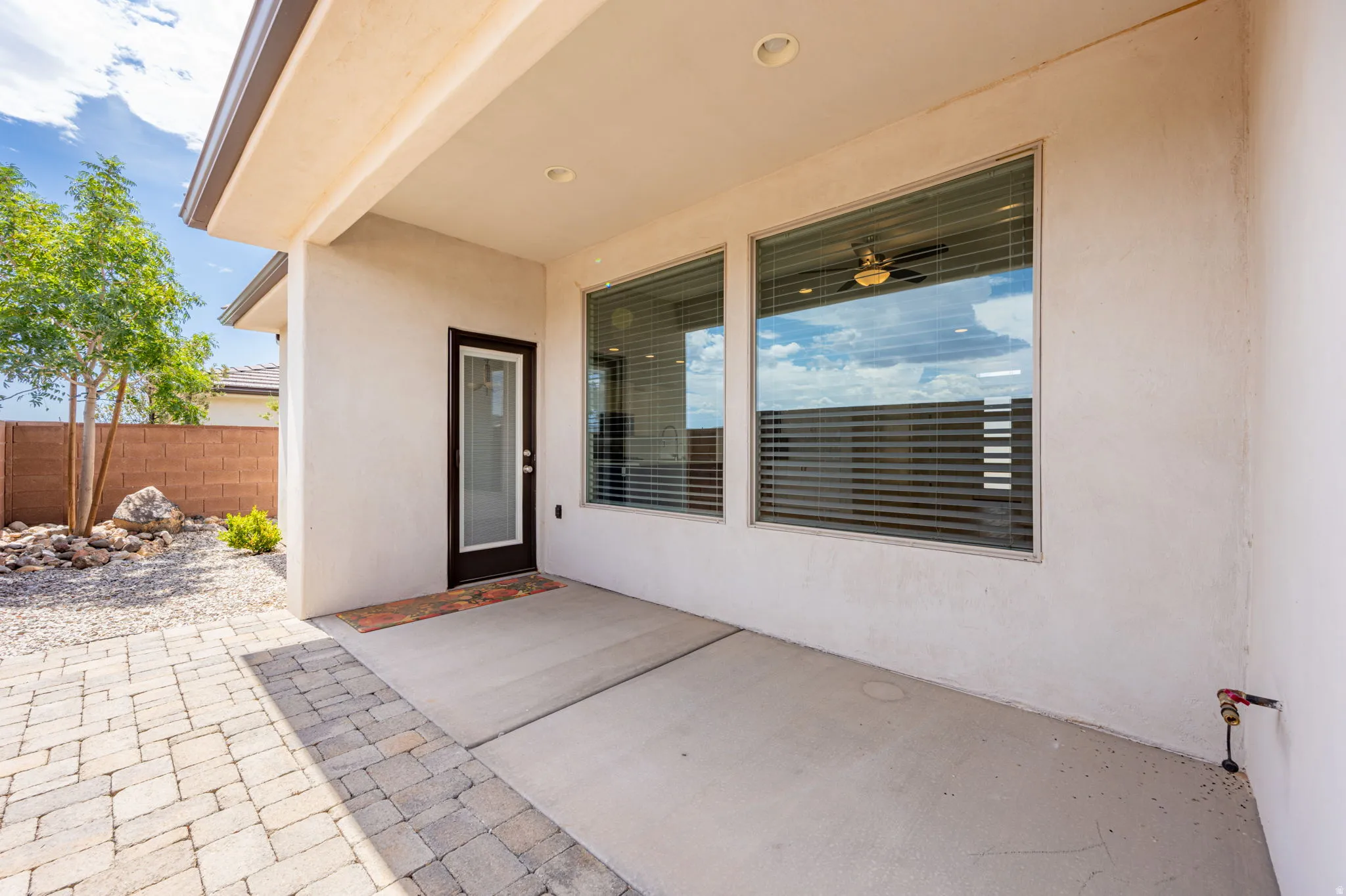 Covered patio featuring concrete flooring and recessed lighting