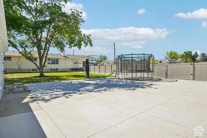 Main Residence Backyard: Basketball Court/RV Parking with double gate.