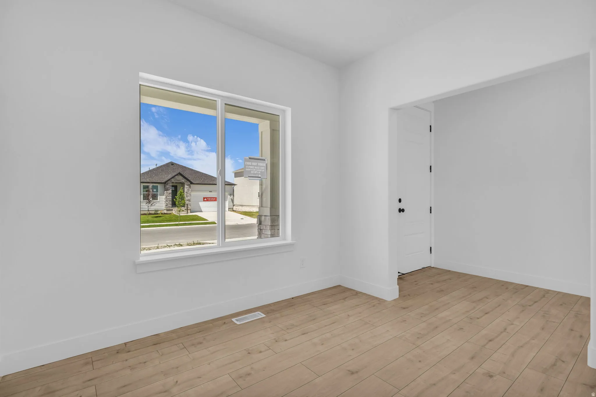 Living room/den adjacent to front entry.