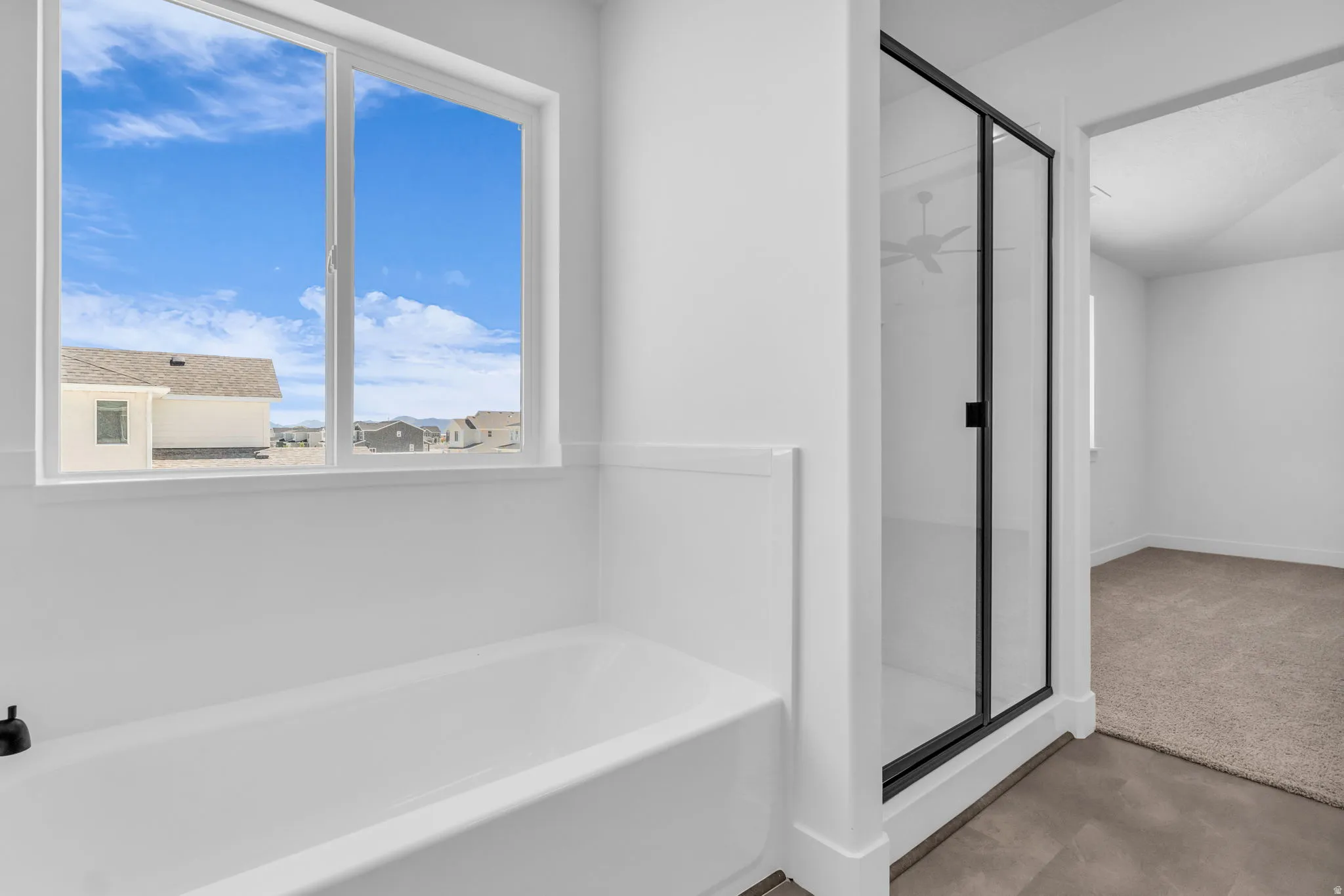 Primary bath with soaker tub and walk-in shower.