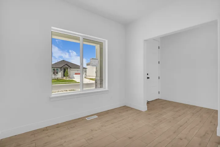 Living room/den adjacent to front entry.