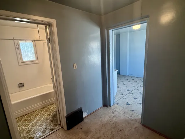 Entyway light blue walls, featuring two doorways