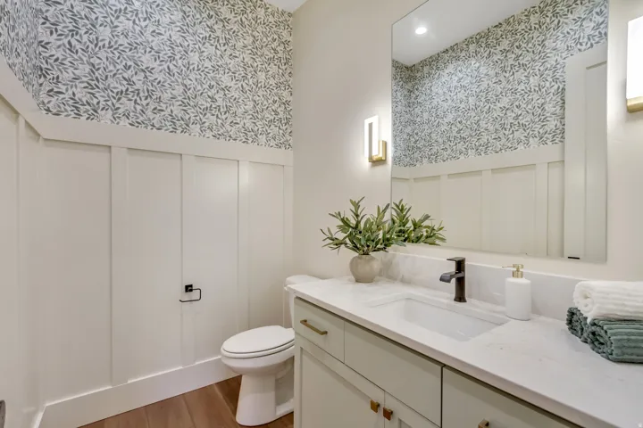 Powder room featuring a white board and batten wall treatment