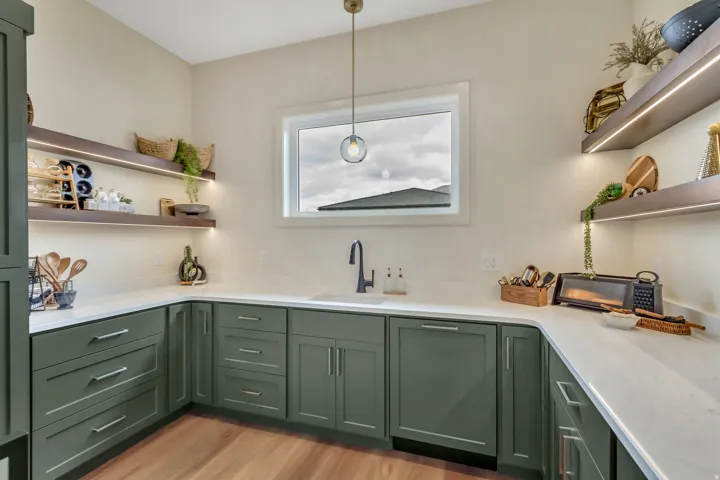 Spacious pantry features a second dishwasher, sink with disposal and plenty of storage
