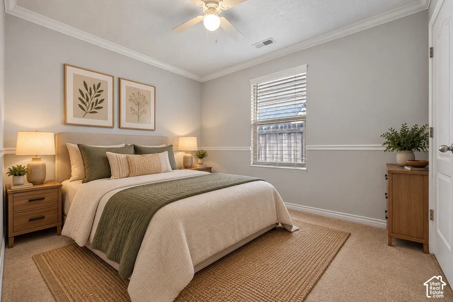 Second Bedroom with neutral-toned walls featuring classic chair rail molding, ceiling-mounted light fixture with integrated fan, window with horizontal blinds, and carpeted flooring. Virtually Staged.