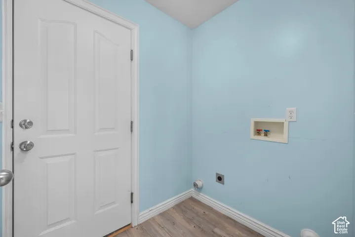 Spacious laundry area with entry to the garage, directly off the kitchen.
