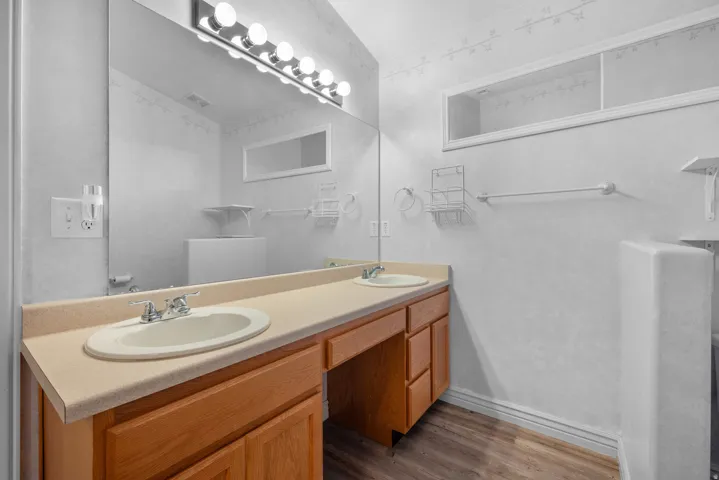 A large Primary Suite bathroom has plenty of room for 2 sinks and ample counterspace!