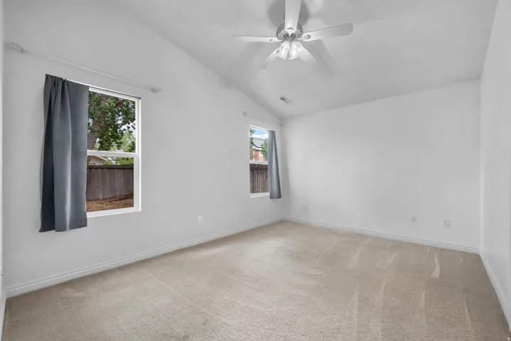 The Primary Suite has vaulted ceilings and lots of natural light!