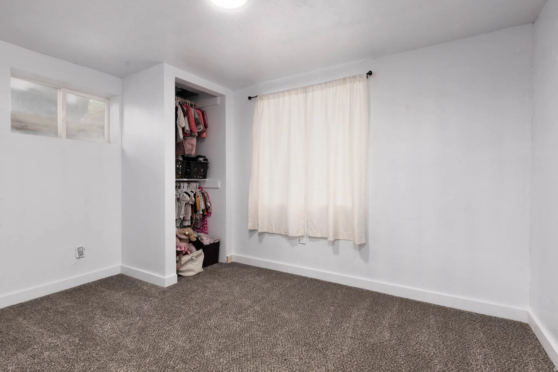 Neutral-toned carpeting paired with white walls