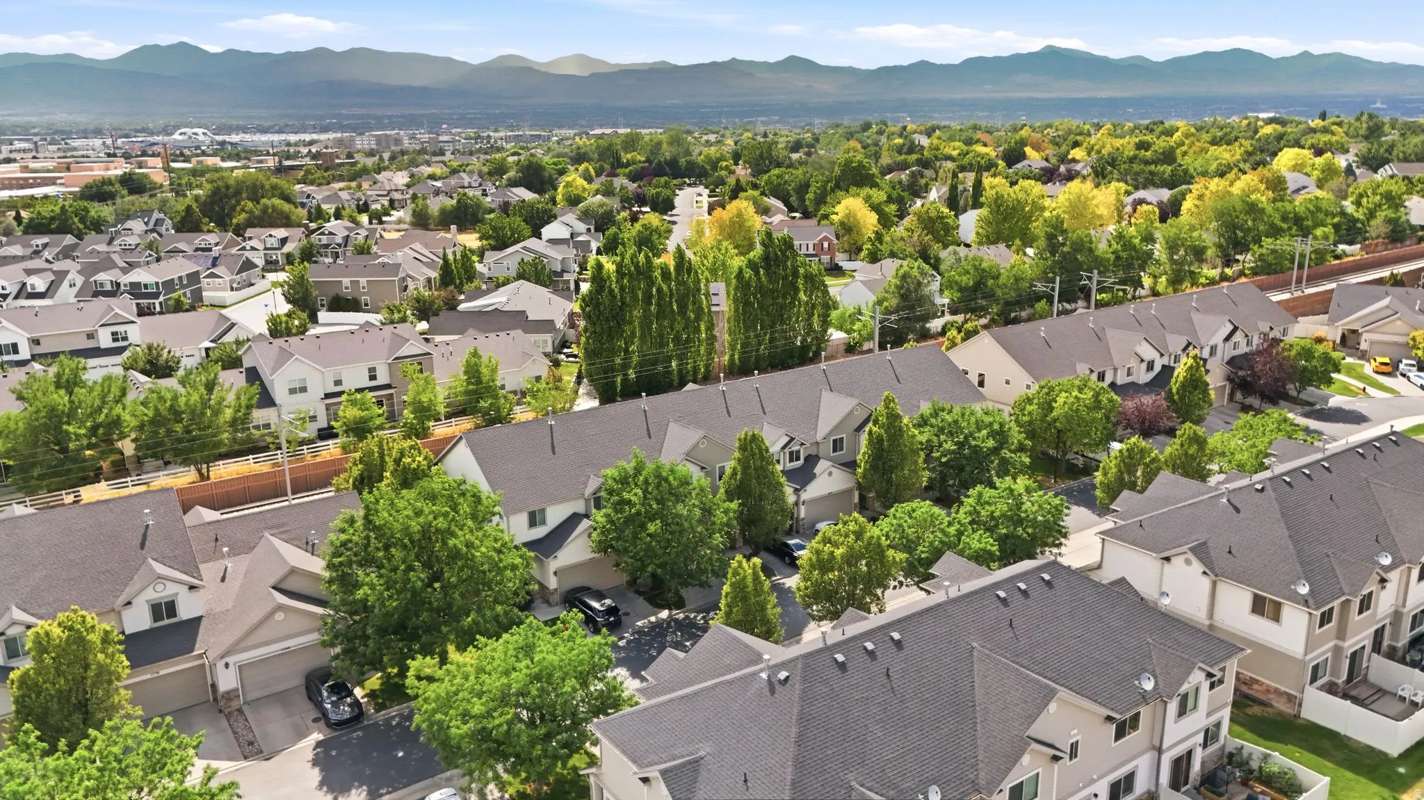 Aerial perspective showcasing a residential community with varied architectural styles and mature landscaping