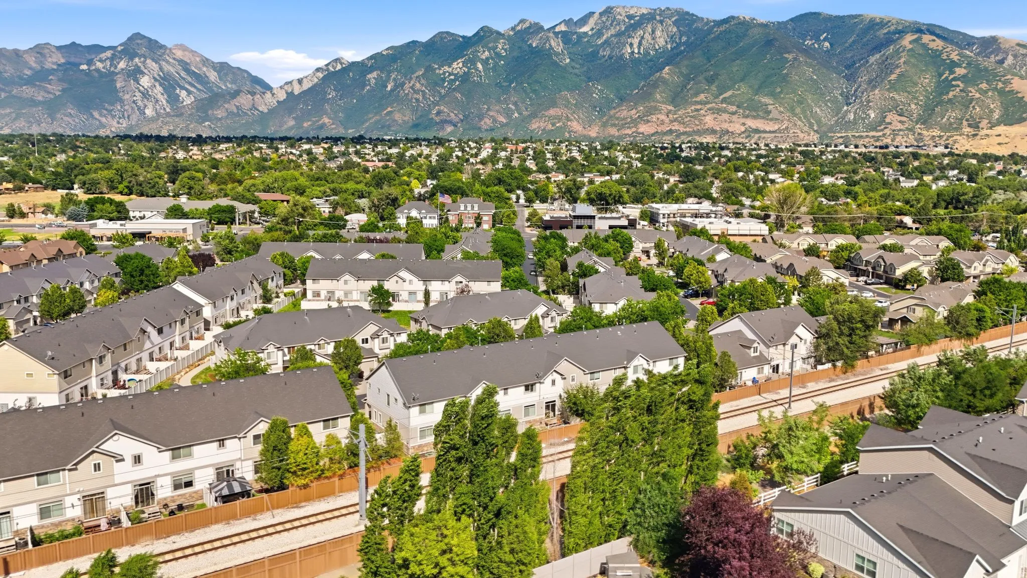 Expansive residential community featuring a variety of homes with dark shingle roofing