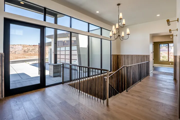 Expansive glass entry with transom windows