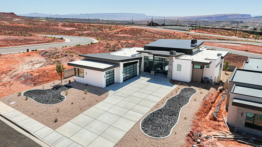 Modern exterior architecture featuring a flat roof and white stucco finish