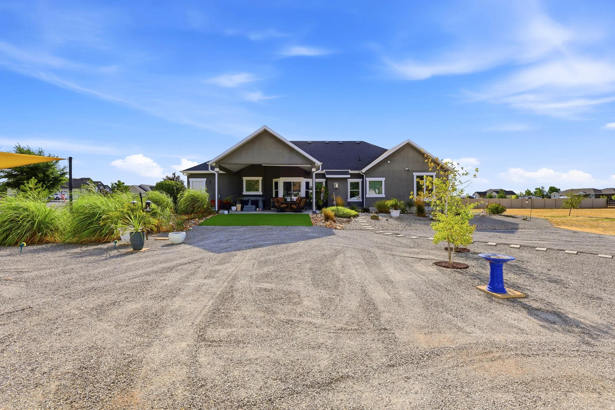 Contemporary residence with a dark gray exterior and contrasting white trim