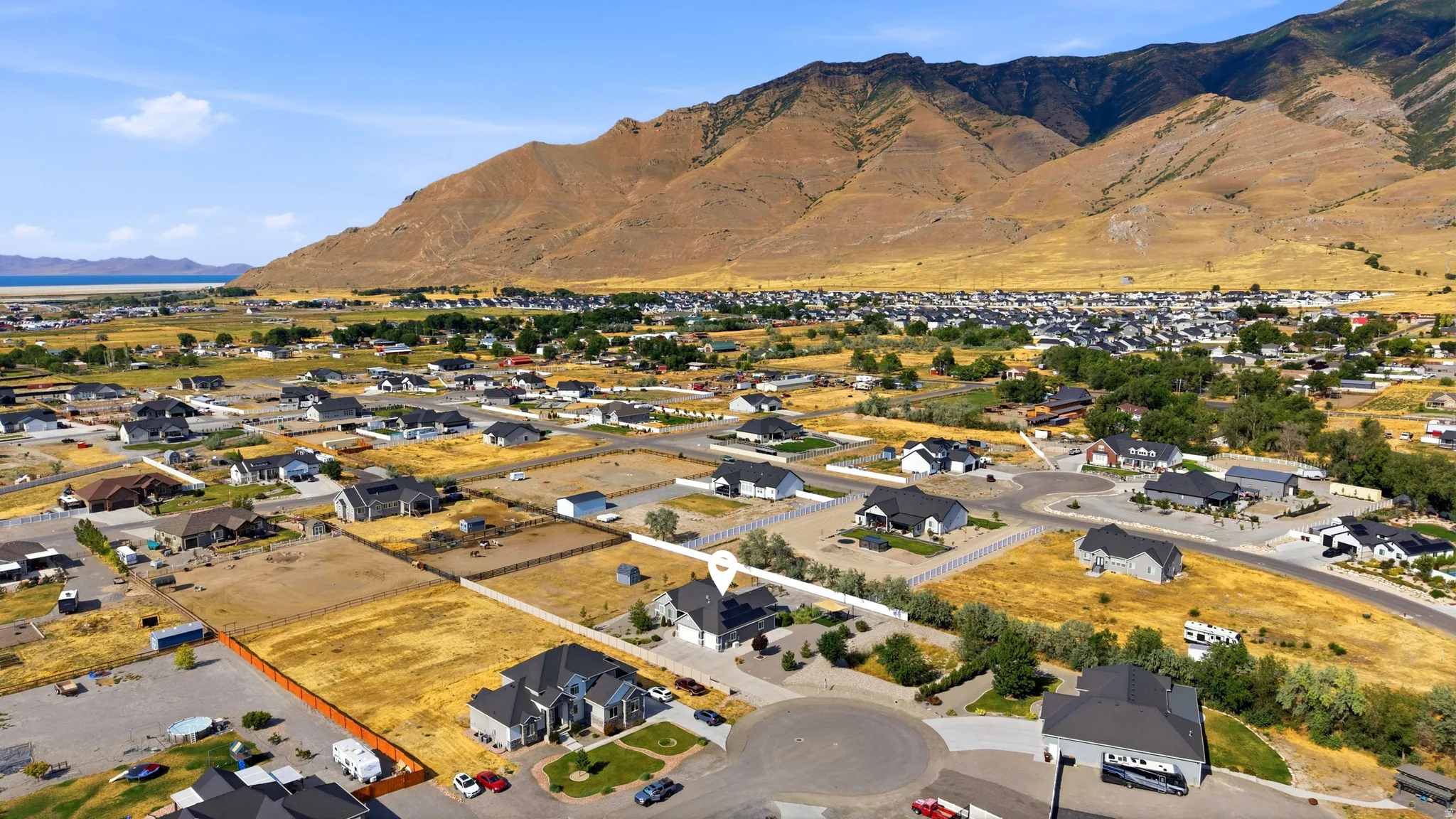 Aerial perspective highlighting a cul-de-sac community with mountain backdrop